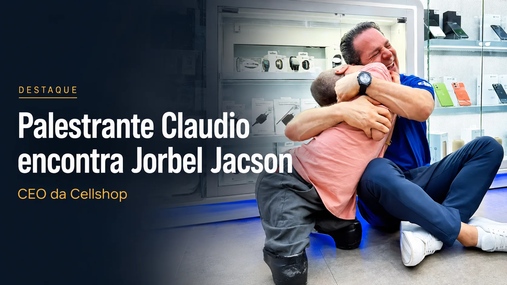 Jorbel Griebeler, CEO da Cellshop, visivelmente emocionado abraçando o palestrante Cláudio no chão da loja em 2026, ilustrando liderança humana e superação.